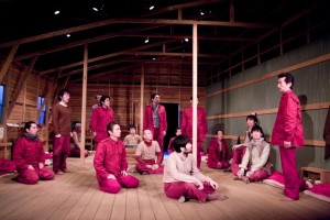 A scene from "Kaura no Hancho Kaigi" with Japanese POWs wearing the crimson uniforms they wore at the Cowra Prison Camp.